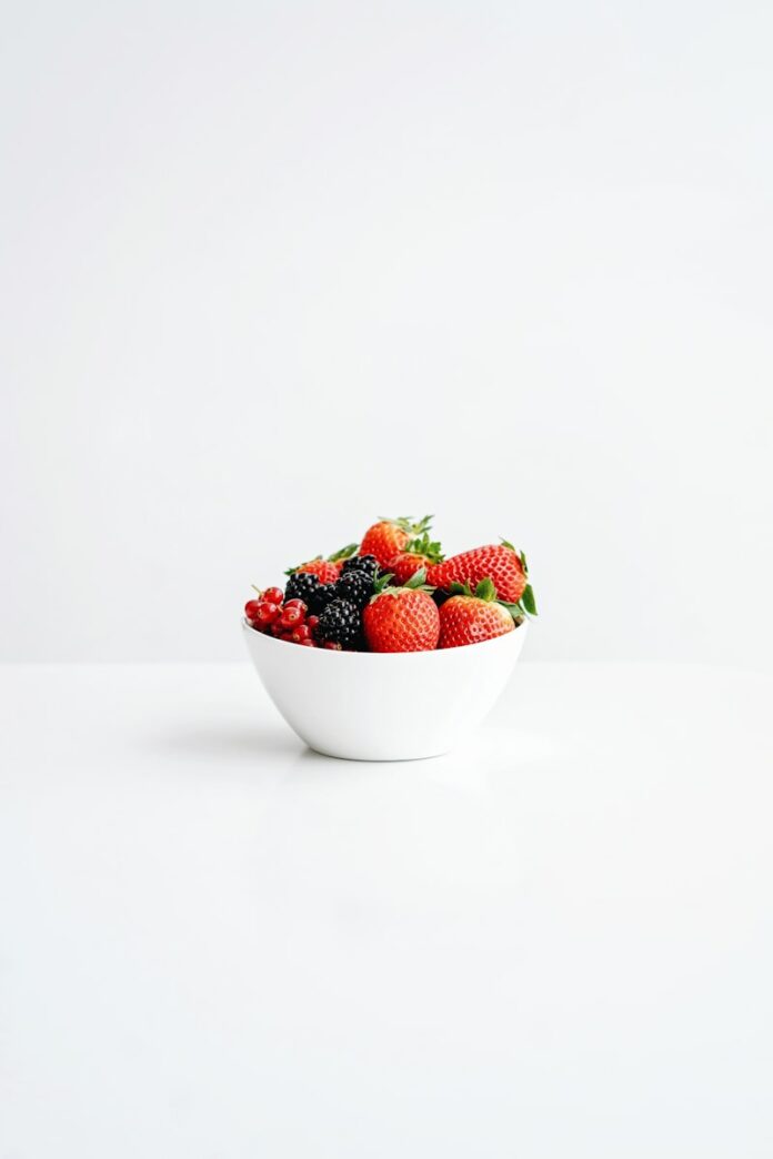 Photo by Olena Bohovyk strawberries in white ceramic bowl