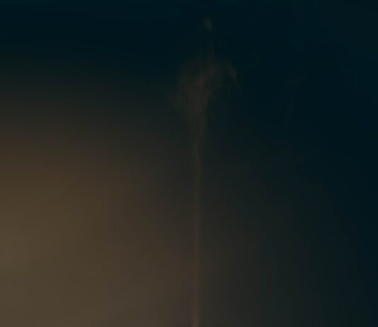 장마철 감기 예방법 a white cup with steam rising out of it